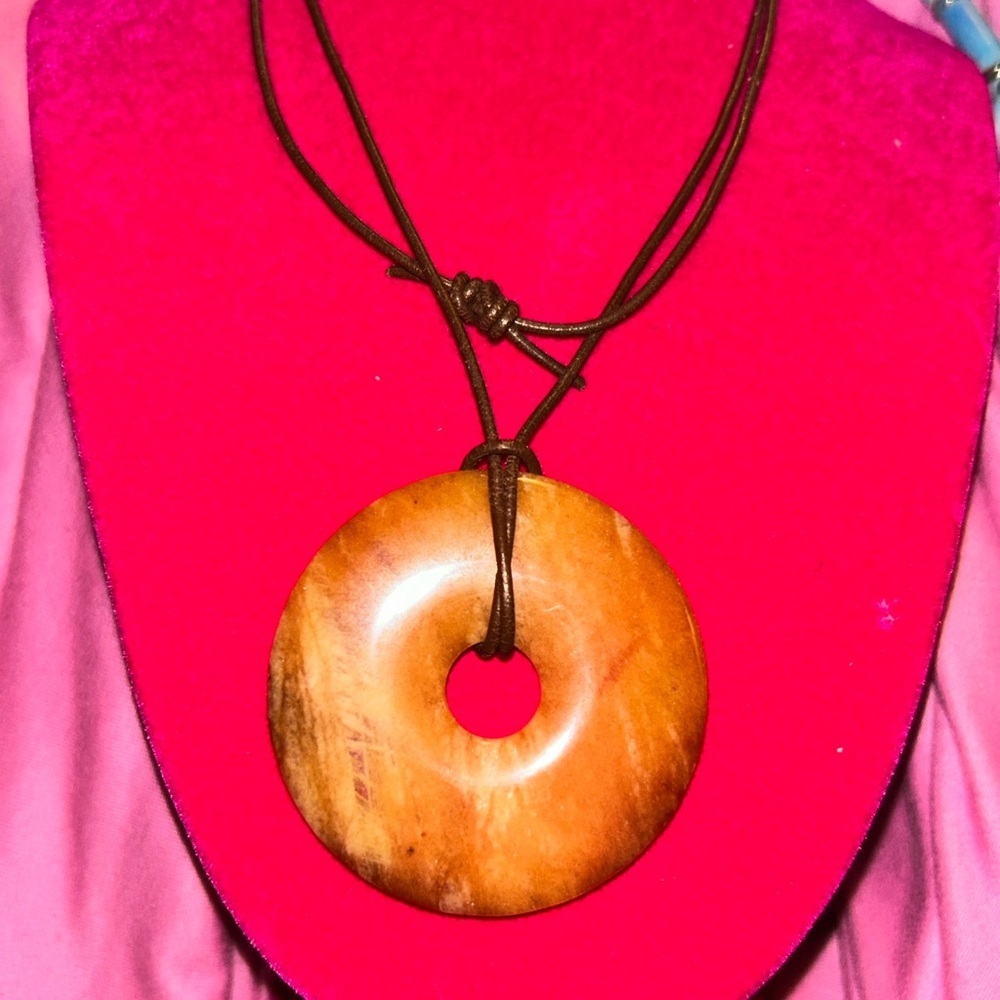 Yellow adventuring natural semi precious gemstone donut energy pendant.